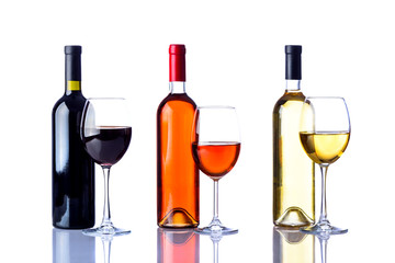 three bottles and glasses of wine