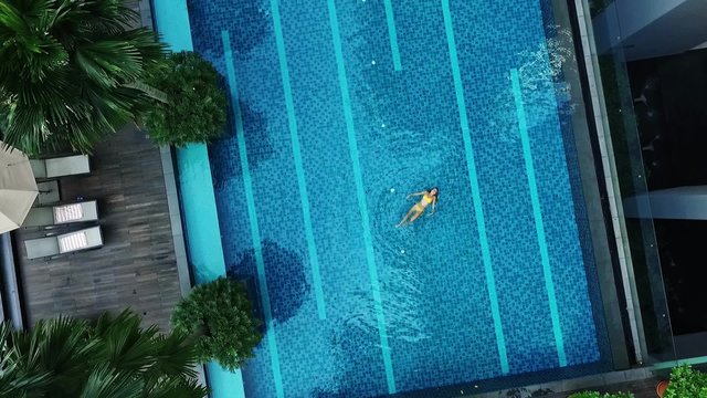 Aerial view of big swimming pool in private property.