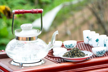 Tea set on a wooden plate