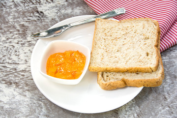 orange marmalade and bread for breakfast