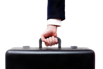 man carries a heavy suitcase: leaving on vacation or giving a large bribe