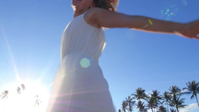 Beautiful Bride Girl in White Dress Running on Beach to Sun