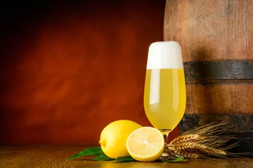 Gordijnen Radler beer glass and lemon © xfotostudio