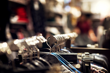 Hanger clothes in the store. Shopping time. Shallow depth of field.