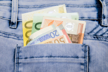 Euro banknotes in the pocket of jeans