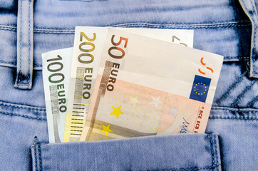 Euro banknotes in the pocket of jeans