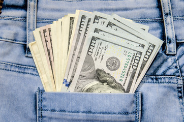 jeans with american 100 dollars bills in pocket