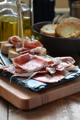 appetizer of ham Serrano with bread roasted