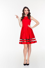 Happy woman pointing finger away