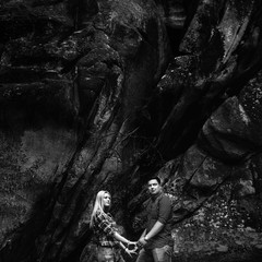 Young beautiful couple in jeans and shirts for a walk in the mou