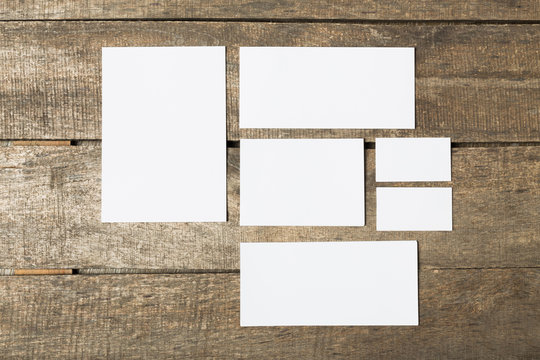 Blank stationery set on wood background