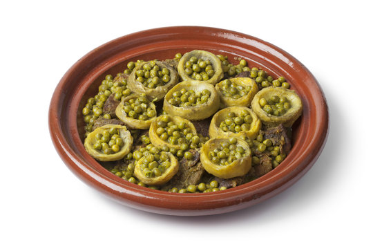 Tagine with meat, artichoke hearts and green peas