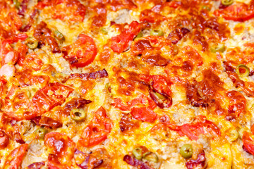 Delicious juicy pizza homemade closeup background.