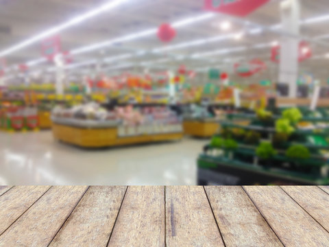 wood counter product display with fruits shelves in supermarket