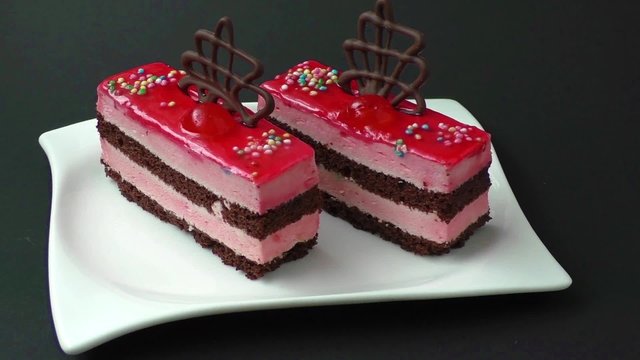 Sweet colorful desserts isolated on a black background
