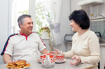 cheerful elderly couple  in   kitchen.