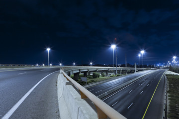 Fototapeta na wymiar Empty Highway At Night