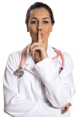 Serious doctor woman making silence sign over white background - obrazy, fototapety, plakaty
