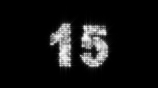 New Years Eve Countdown - Shiny, spectacular New Year's Eve Countdown with flashing strobe countdown numerals and text, "Happy New Year" with colorful confetti and exploding fireworks.