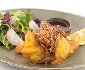 Fried prawns in dough isolated on white