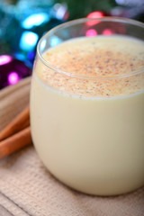 Glass of eggnog in a Christmas setting