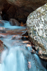 great wonders of nature - close up of soft silk river flowing in the rocks in long exposure