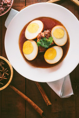 Eggs and pork in brown sauce,Thai Cuisine,shallow Depth of Field,Focus on pork. 