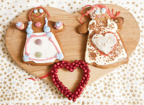 On Display. An afternoon of baking and decorating has left gingerbread women in various shapes and colours all ready for wrapping up for Christmas presents.