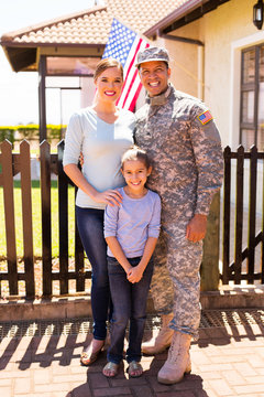 Young Military Family Standing Together