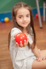 Fototapeta na wymiar Girl holding a plastic ball