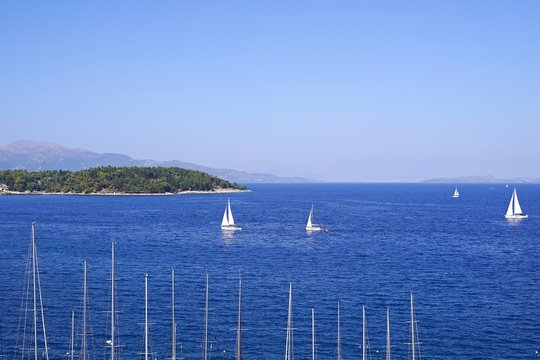 Fototapeta sea landscape with yachts and a massif on the horizon