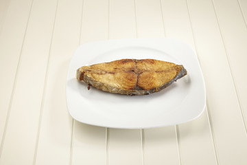 deep fried seer fish on a plate