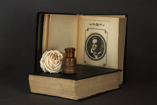 Goethe poems book with rose and medicine bottle