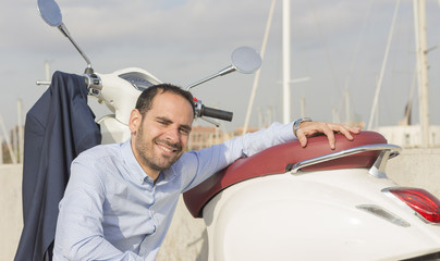 Business man with his scooter © Victor