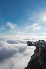 View of an Skywalk high above a smokescreen in front of blue sky in Lower Austria