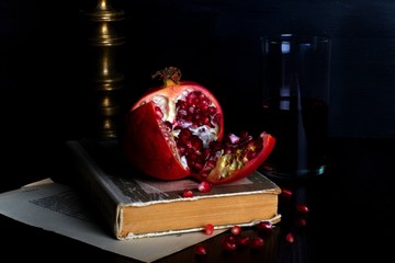 tasty ripe pomegranate on a dark background