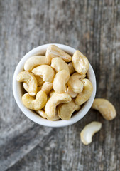 cashew nuts on wooden surface