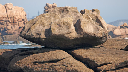 Rocks on a beach along a sea in summer