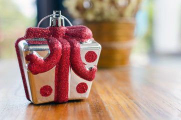 Christmas gifts on wood table.