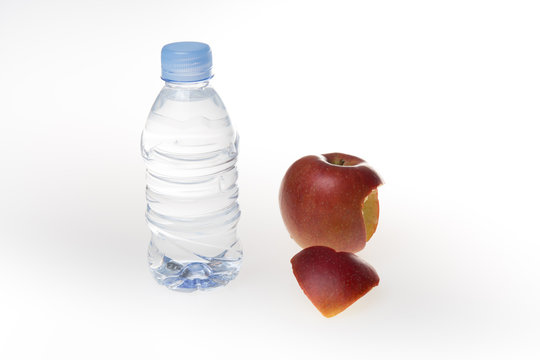 A clean fresh bottle of water and fruit. Healthy lifestyle