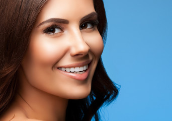 beautiful smiling woman, on blue