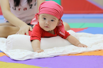 Five-month-old child in the play room.