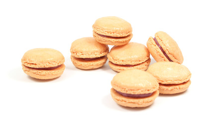 Obraz na płótnie Canvas French macarons stuffed with raspberry filling on a white background.