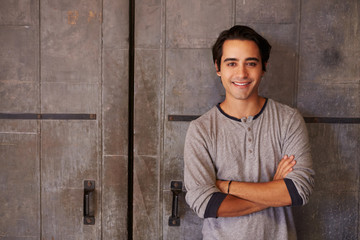 Portrait Of Male Designer Standing In Modern Office