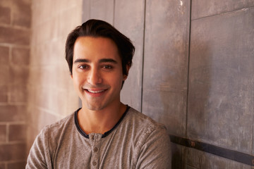 Portrait Of Male Designer Standing In Modern Office