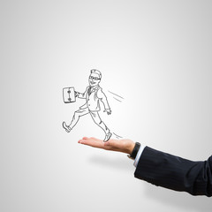 Caricatures of businessman in palm
