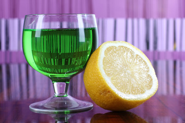 Glass jars with colorful cocktails on table