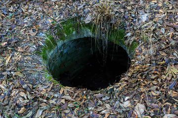 abandoned manhole well
