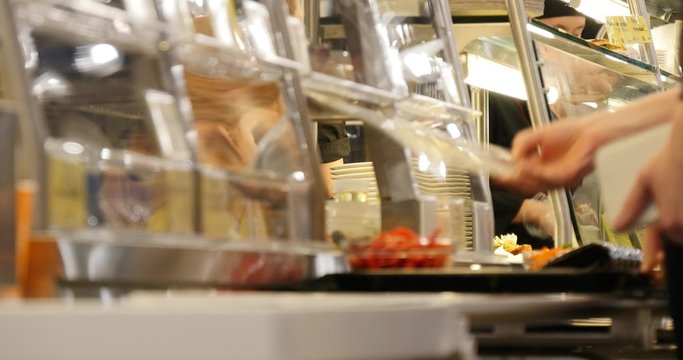 people in the canteen  choose what to eat