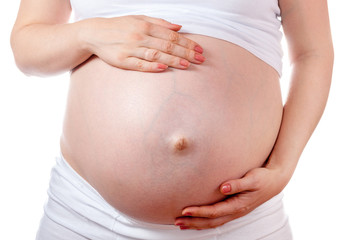 Pregnant Woman Belly. Pregnancy Concept. Isolated on a White Bac